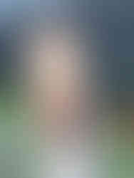 female holding pickleball paddle singapore