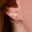 Thumbnail: Open Fox Hoops Earrings pairs  on ear