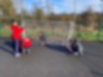 Students assembling soccer goal outdoors