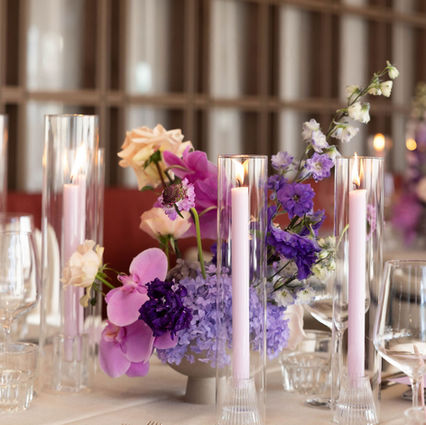 pink and purple table flower arrangements and candle stylings