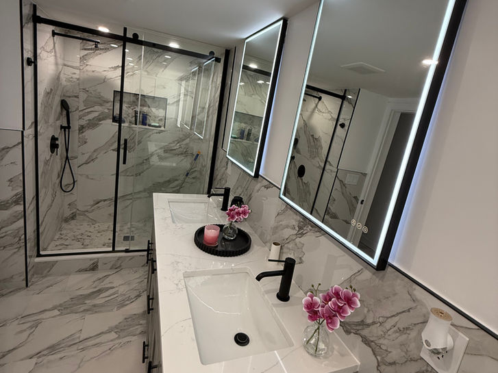modern marble bathroom remodel with walk in shower double vanity and led mirrors in paramus nj