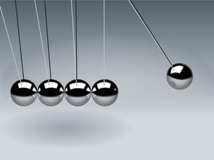 Newton’s cradle illustrating the momentum and seamless handoff central to AI-human collaboration in modern customer experience.