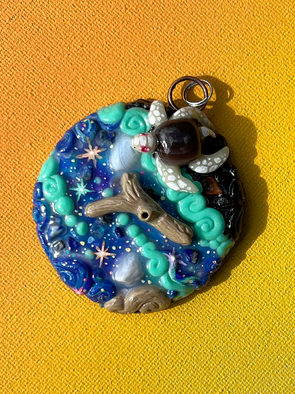 Thumbnail: Albino Turtle Galaxy Beach Painted Polymer Clay Sculpted Necklace