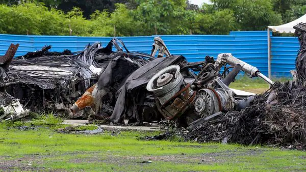 Wreckage of Air India's Boeing 787-8 aircraft, which was operating flight AI 171 from Ahmedabad to London, placed under tight security, seen a month after the tragedy, in Ahmedabad, Saturday, July 12, 2025.(PTI) | Mint