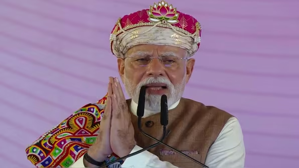 Prime Minister Narendra Modi greets the gathering in Madhya Pradesh's Dhar on Wednesday. ANI | Firstpost