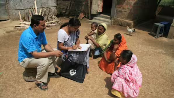 Census officials collect details from village women during first phase of the census at Hatkhuwapara Village, near the northeastern Indian city of Guwahati April 1, 2010 for the 2011 census. (Photo: Reuters) | Firstpost