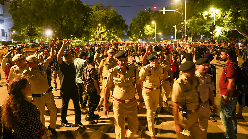 Police personnel at the site during the protest by Cockroach Janta Party (CJP) demanding the resignation of Union Education Minister Dharmendra Pradhan over the NEET paper leak issue, at Jantar Mantar, in New Delhi, late Friday, July 24, 2026.(Photo | PTI) | The New Indian Express