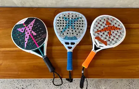 3 options for rental rackets - basic on the left and premium on the right and middle