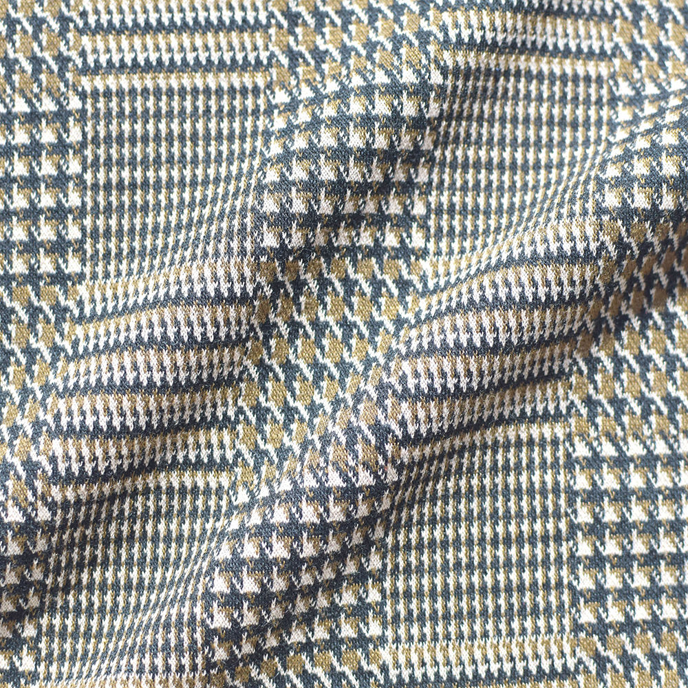 The front side of the black and yellow jacquard fabric