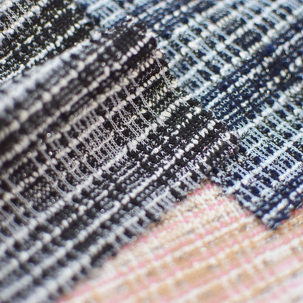 The front side of the black knit boucle