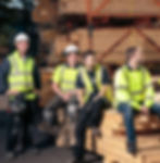 4 People Working On Timber Frame