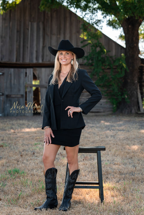 Headshot branding session of woman in cowgirl hat and boots, modern western aesthetic
