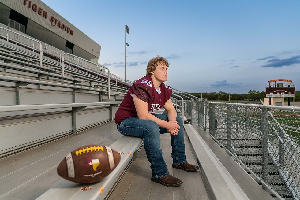 Senior guy in stadium for fall sports portrait in South Austin