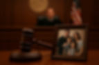 picture of family and a court gavel
depicting domestic violence trial