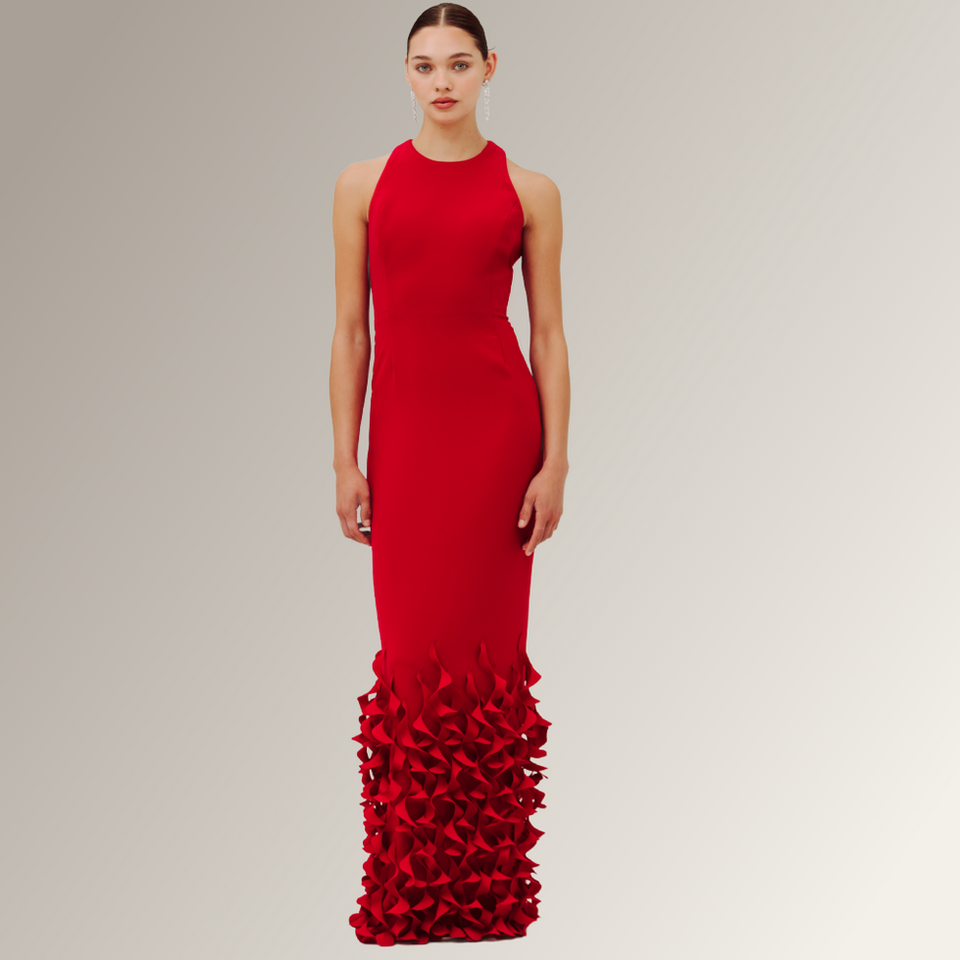 Racer neckline sleeveless slim red gown with rows of laser petals at hem. Available to order in other colors. Catherine Regehr