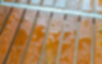A close-up of wet, slippery wooden decking