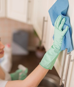 side-view-woman-cleaning-surface-with-cloth-kitchen.jpg