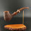 Thumbnail: bent tobacco pipe