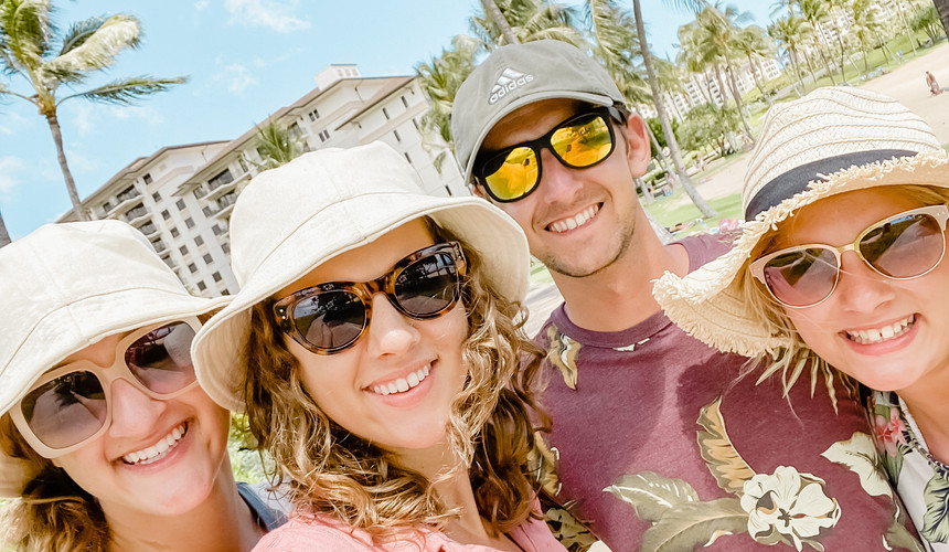 family selfie with palm trees