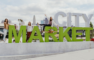 family on a city market sign