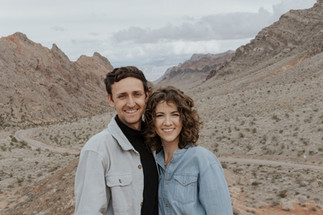 couple in front of neutral mountain