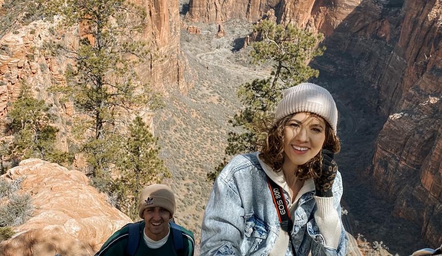 couple hiking up angels landing