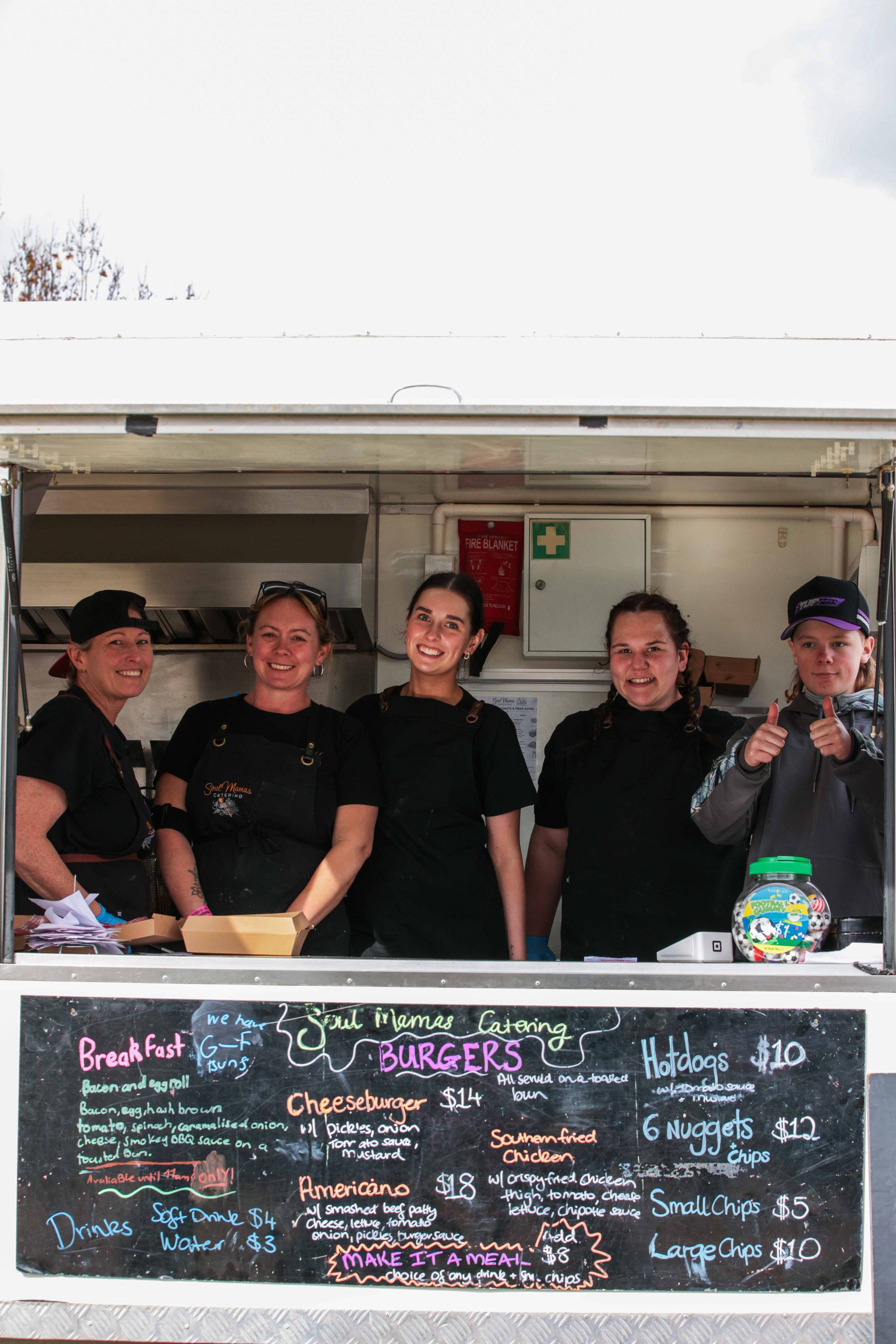 Jessmyn and the Soul Mamas team in the food trailer