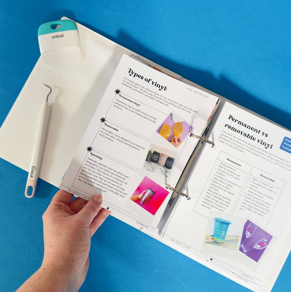 the cricut club handbook open on desk