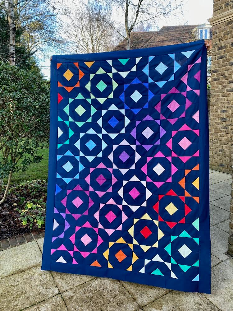 Thumbnail: Colorful geometric quilt with circles and squares