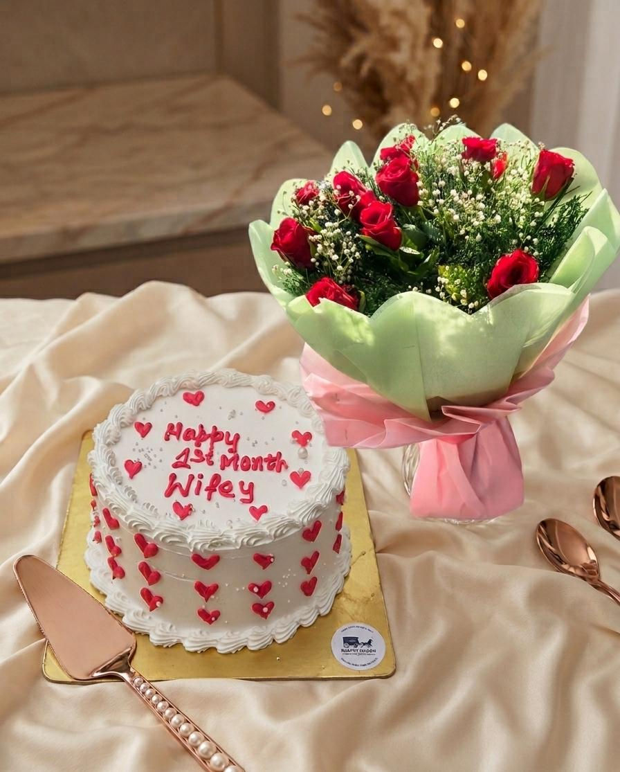 Eye-level view of a vibrant flower bouquet next to an elegant eggless cake on a celebration table