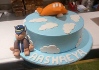 Aeroplane theme cake with paw patrol character