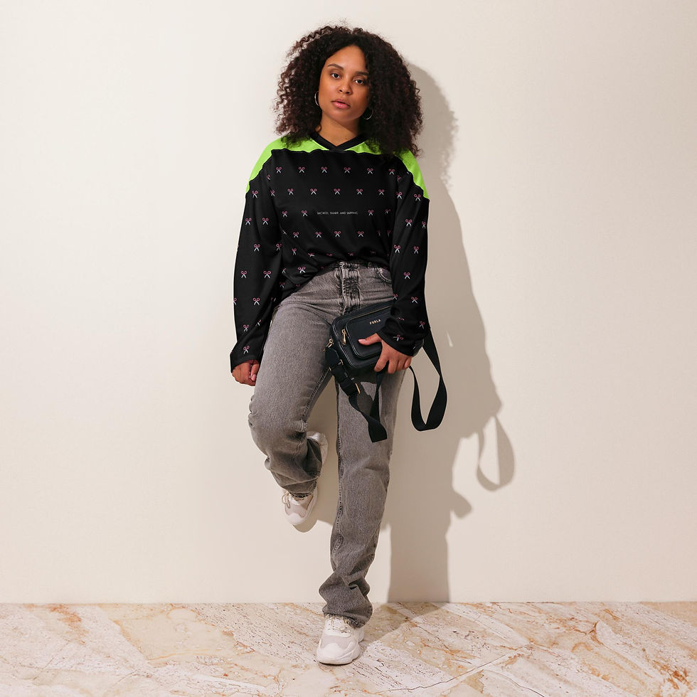 Black femaBlack and neon long sleeve shirt with bold text in the center "sacred, sharp, and sapphic"