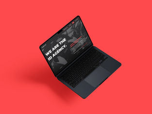 Laptop on a red background displays text "WE ARE THE ID AGENCY." on screen. Black and white visuals add a modern, professional feel.