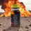 Thumbnail: Mountain Man Honey and Goods "Ticking Time Bomb"-Carolina Reaper shown in 7 oz. container with explosion in a desert setting.