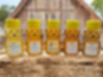 Thumbnail: Specialty honey bears 5 pack on a wooden block with a rustic barn in the background.