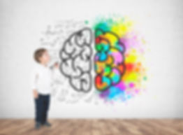 cute-little-boy-white-shirt-dark-jeans-holding-marker-looking-upwards-concrete-wall-with-c