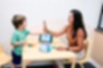 Our SLP and a client celebrate their therapy session