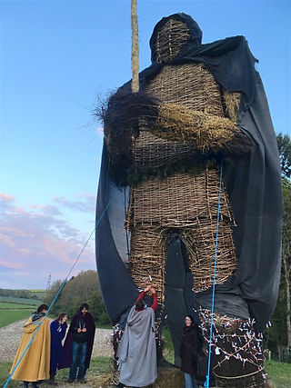 People attaching wishes to the wickerman