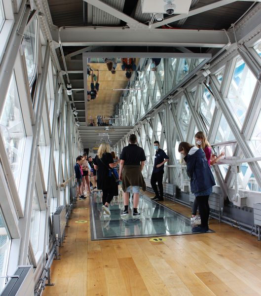 People standing on the glass walkway at Tower Bridge