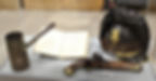 A coffee pot, book and helmet