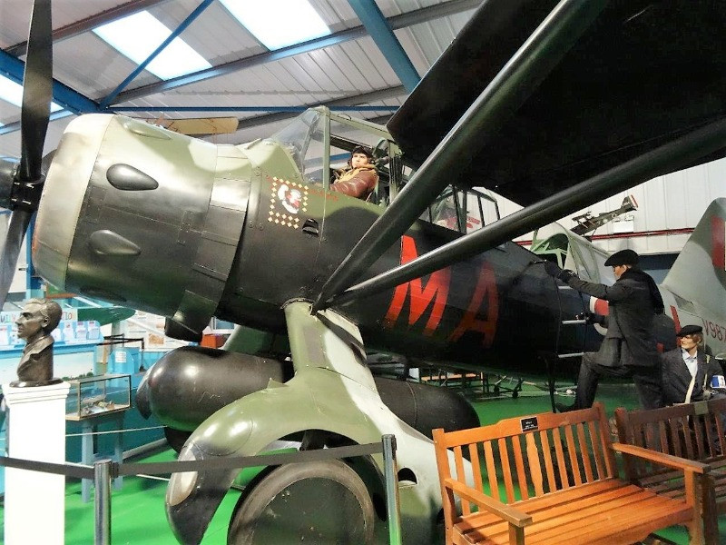 A mannequin sitting in a World War I plane