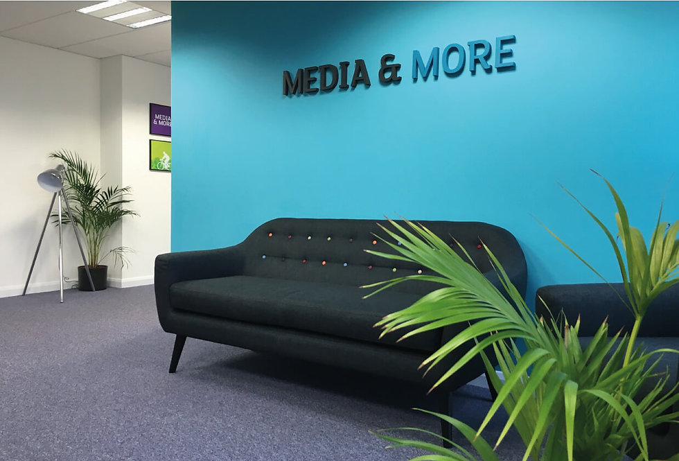 Media & more signage on reception wall