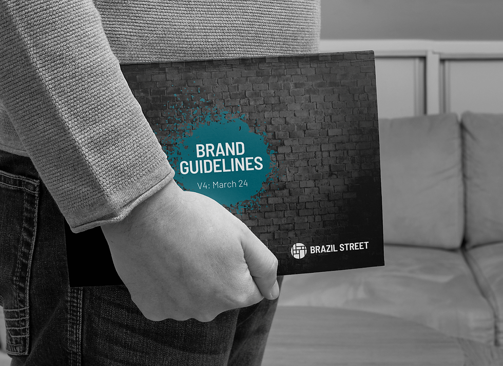 Cover design for brand guidelines showing graffiti on a brick wall