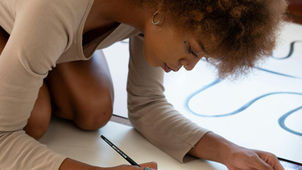 A woman finding balance between independence and connection by painting.