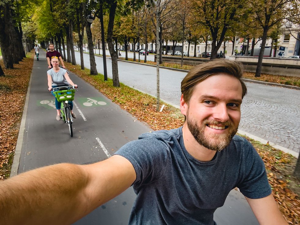 Cyclists riding through Paris France on a fall day 