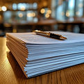 StockCake-Stacked paperwork focus_1747710571.jpg