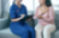 Doctor in blue scrubs consulting a patient with chest discomfort, illustrating personalized heart care at Sunrise Heart Specialist Clinic in Singapore.