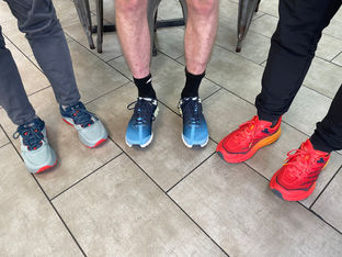 Three pairs of running shoes pre-race