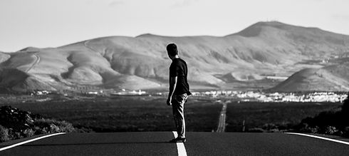 man-skateboarder-riding-empty-highway-road-with-amazing-hills_edited.jpg