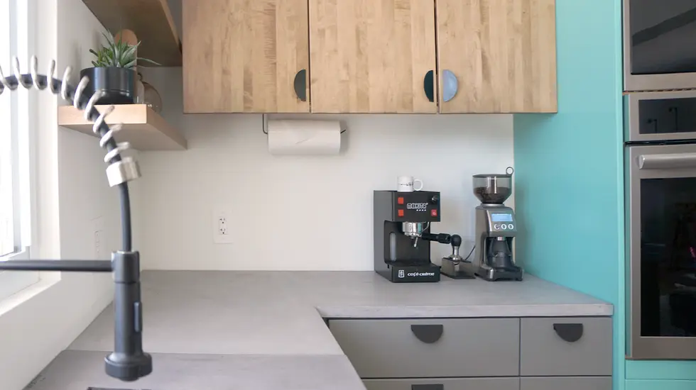 Newly renovated kitchen. Concrete countertops. Wood cabinets. Grey cabinets. Teal Cabinets.